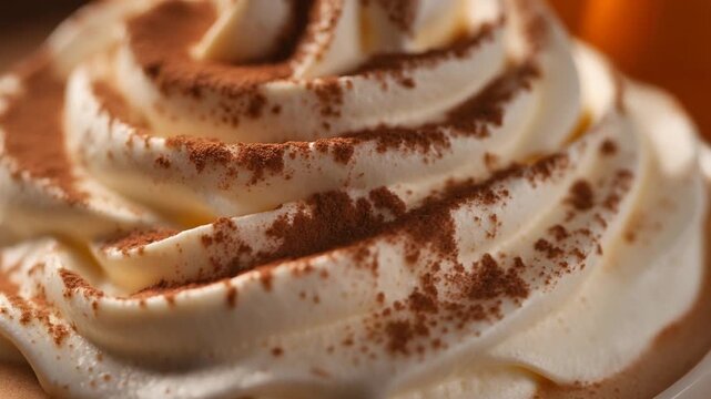Close Up Macro Shot of Fluffy Whipped Cream with Cinnamon Sprinkles on Pumpkin Spice Latte