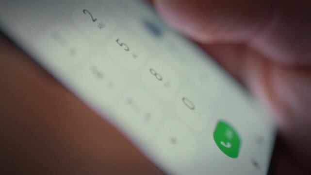 Man's hands carefully hold sleek smartphone, his fingers swiftly dialing phone number on touch keyboard. This modern technology enables seamless communication, revolutionizing the way people connect