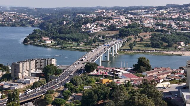 Aerial view of Ponte Infante Dom Henrique spanning the Douro River with heavy traffic and surrounding urban landscape in Vila Nova de Gaia, Porto, Portugal.