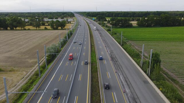 Aerial view of the e-highway test track for electric trucks with overhead power lines along the motorway in Weiterstadt, Hessen, Germany.