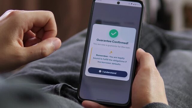 User receives confirmation of guarantor status on a mobile device, reflecting fintech growth, remote contracts and personal liability in modern credit agreements.