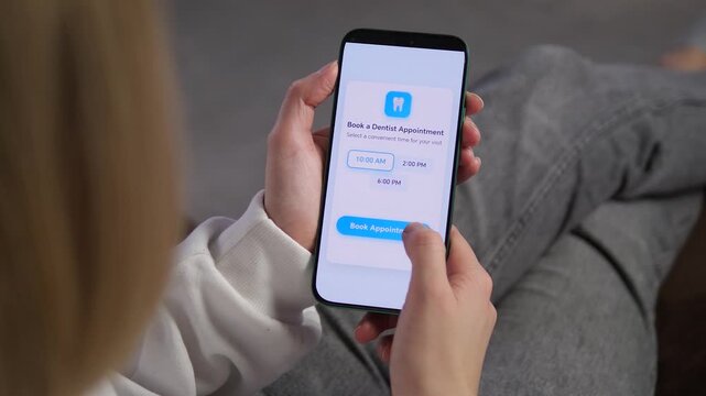 Patient selects a dentist visit time through a mobile interface, highlighting modern healthcare access, online booking and the shift toward contactless medical services.