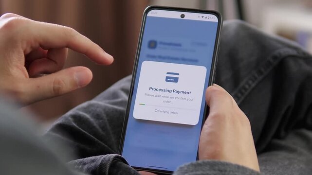 Buyer confirms and pays for real estate services on a smartphone, showing the rise of digital property transactions, mobile payments and remote home buying.