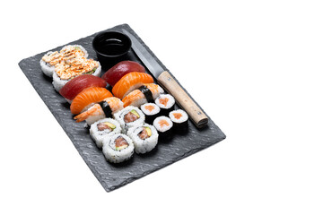 Assorted sushi platter with nigiri, maki and uramaki isolated on white background. Copy space © chandlervid85