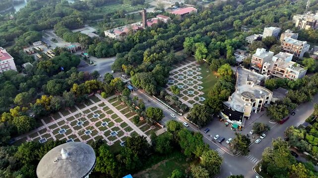 Aerial view of urban landscape with geometric gardens and lush trees in Greater Noida, Uttar Pradesh, India.
