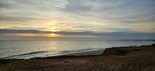 Sunset over the Atlantic Ocean on the Algarve coast, Portugal © Olesja