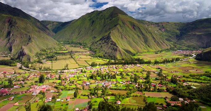 Scenic location of Huayllabamba among lush mountains in Sacred Valley. Aerial