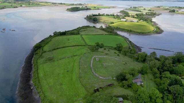 Drone aerial view of green islands and fields in  at Mahee Island, Strangford Lough, Northern Ireland