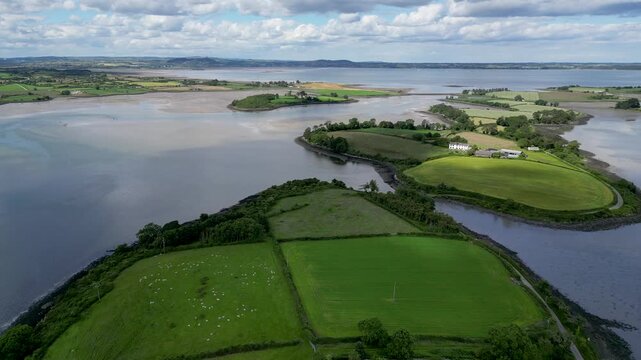 Drone aerial view of green islands and fields in  at Mahee Island, Strangford Lough, Northern Ireland