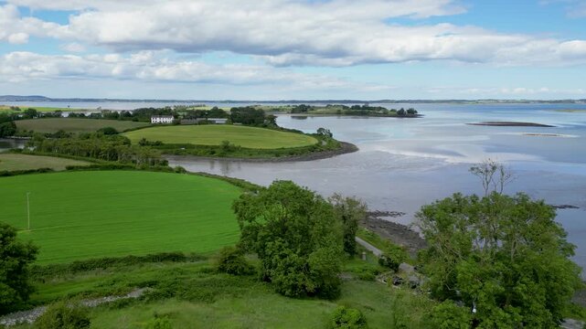 Drone aerial view of green islands and fields in  at Mahee Island, Strangford Lough, Northern Ireland