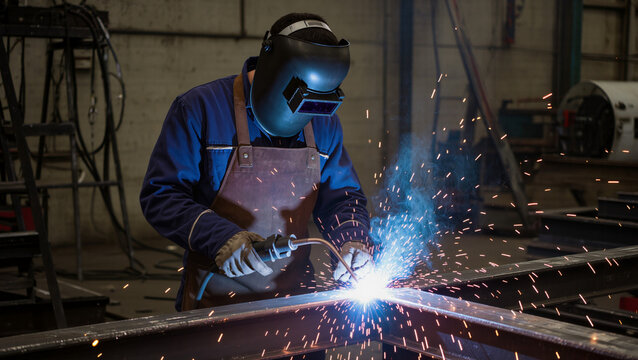 Industrial Welder Working on Metal Structure