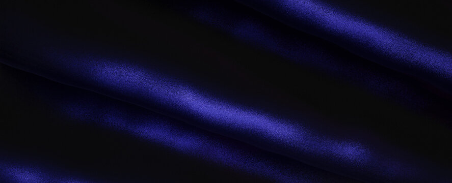 Abstract Dark Blue Light Swathes Across Smooth Fabric Surface Creating Moody Textured Panorama Background for Design and Luxury Concepts