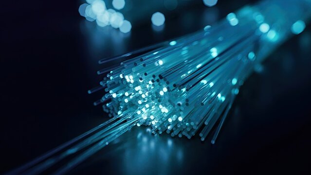Fiber optic cables transmitting data a high speed network connection concept with glowing blue light
