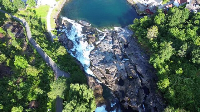 Drone Descending From Hellesyltfossen Waterfall Into Hellesylt Village, Norway