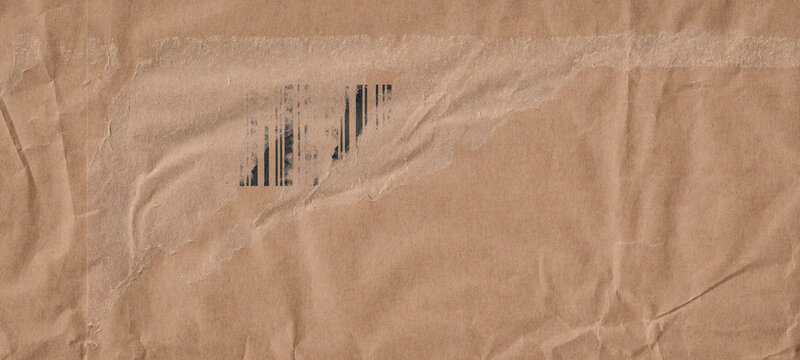 Frame made of brown beige old vintage paper with damaged barcode, crumpled wrinkled cardboard carton packaging package, pattern texture background banner panorama