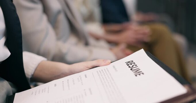 Paper, hands and waiting room with resume for interview, job opportunity or hiring in office. Business people, document or candidates with CV for career portfolio or recruiting process in workplace
