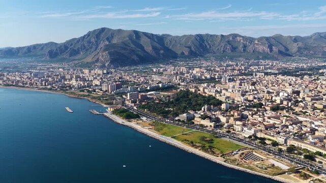 Palermo, Sicily in Italy. Aerial 4K panoramic drone view of the sea, ferry and passenger port, boats and Mediterranean urban architecture. Majestic view of the resort town and ancient castle.