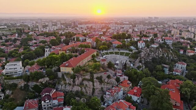 Plovdiv sunrise aerial view ancient theater old town Bulgaria drone footage Roman amphitheatre cityscape historical center travel tourism destination landscape Europe