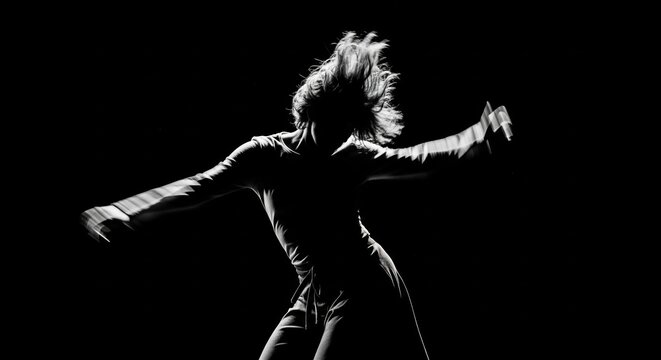Dynamic Black And White Silhouette Of A Woman Dancing With Flowing Hair And Arms