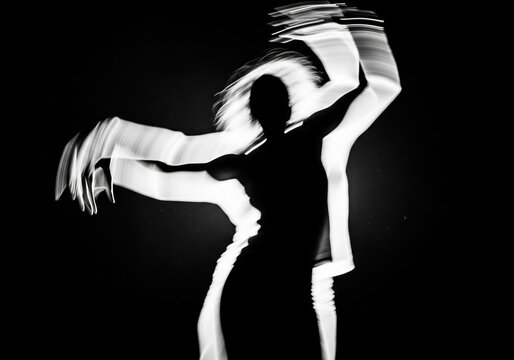 Black And White Long Exposure Photography Of A Dancing Person With Motion Blur