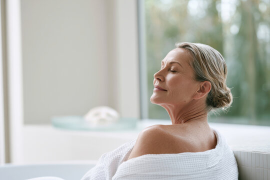 A woman in a spa enjoying a serene moment, showcasing beauty and self-care, perfectly capturing the essence of relaxation amidst a tranquil atmosphere.