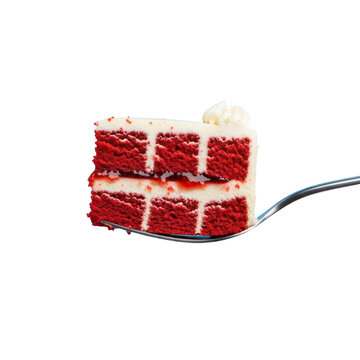 Red velvet cake slice with cream topping served on fork, isolated