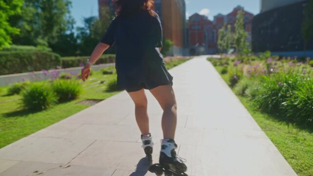 A Joyful Rollerblader Glides Through a Sunlit Pathway Surrounded by Lush Greenery and Colorful Flowers, Capturing the Essence of Outdoor Fun and Freedom
