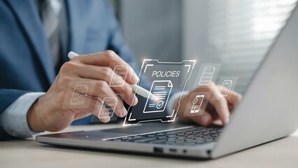 Fototapeta premium Businessman using laptop for digital policies compliance and document management system