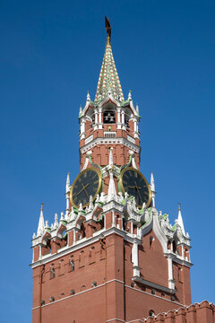 Kremlin chimes on the Spasskaya Tower in close-up. The Moscow Kremlin, Russia (vertical)