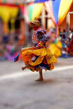 Bhutan, in the village of Bumthang, a monk mask dancer in his colourful costume dances at the festival of Jakar.
blurred background