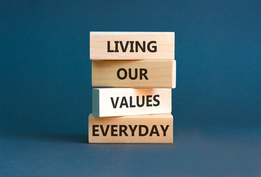 Living our values everyday words symbol. Concept words Living our values everyday on beautiful wooden blocks. Beautiful grey background. Business living our values everyday concept. Copy space.
