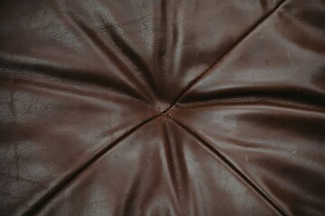 Obraz premium Macro Dark Brown Leather Hide Grain and Radial Creases