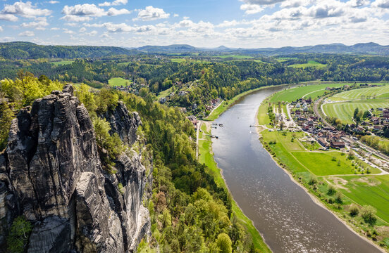 High angle view over Elbe river bend and Rathen town from Bastei rock in Saxon Switzerland National Park, Saxony, Germany, scenic landscape