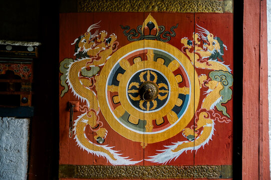 Bhutan,  Mandala painted on a wooden entrance door.