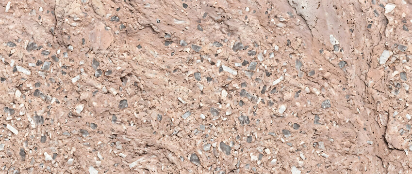 Volcanic tuff texture featuring a dense mix of light brown ash matrix and angular volcanic rock breccia fragments creates a rugged natural abstract backdrop for architectural and industrial designs