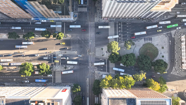 Aerial view of a busy city intersection with urban traffic, buses, and surrounding buildings in Rio de Janeiro, Rio de Janeiro, Brazil.