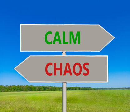 Calm instead chaos words symbol. Concept words Calm Chaos on beautiful grey road sign. Beautiful blue sky background. Business medical psychology calm chaos concept. Copy space.