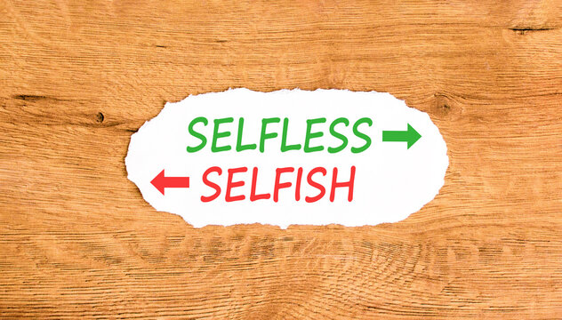 Selfless instead selfish words symbol. Concept words Selfless Selfish on beautiful white paper. Beautiful wooden background. Business medical psychology selfless selfish concept. Copy space.