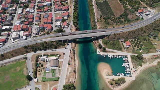 Nea Potidea town and marina over turquoise canal and bridge