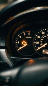 Illuminated Check Engine Light on a Modern Car Dashboard
