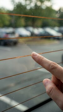 A tactile encounter with a vehicle rear window defroster