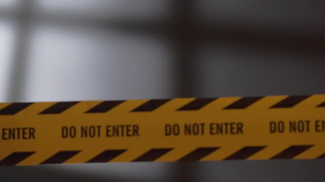Rack Focus from Blurry Basement Window Shadow to Sharp Do Not Enter Caution Tape at Crime Scene at Night, Grim Haunting Atmosphere with Flashing Red Blue Police Siren Lights in Dark Room⁠