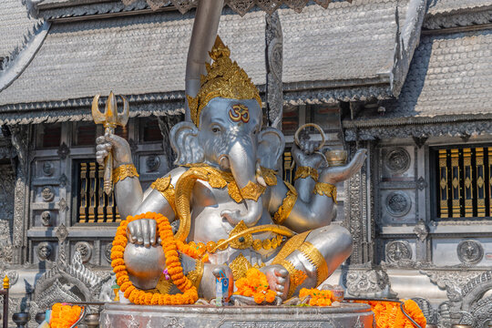 Chiang Mai, Thailand-February 10, 2026;  Close up of Ganesh or elephant statue at Wat Sri Suphan known as the Silver Temple showcases the meticulous hand-tooled metalwork of local Lanna artisans. 