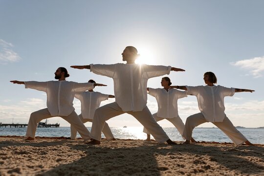 The Beach Tai Chi Pose Silhouette of Five Practitioners by the Sea at Sunset