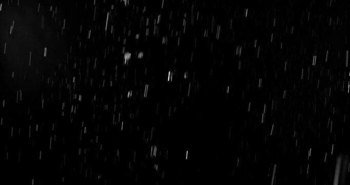 Realistic motion blurred rain streaks falling on a black background creating a natural weather VFX overlay ideal for compositing visual effects digital artwork atmospheric scenes and graphic design pr