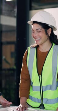 Architecture, high five and people in meeting with success for building approval, floorplan and renovation. Engineering, team and woman with blueprint, victory and agreement for remodeling project