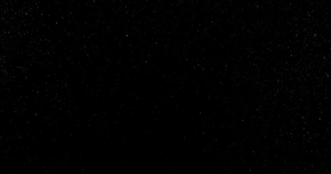 Fine water mist drifting across a black background creating a realistic atmospheric VFX overlay with soft floating droplets perfect for compositing visual effects digital artwork and cinematic environ