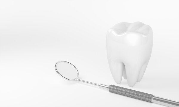 Teeth and a dental mirror on a white background with copy space.