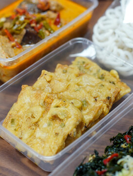 Close up of tempe mendoan, traditional Indonesian fried tempeh with scallions, authentic street food concept