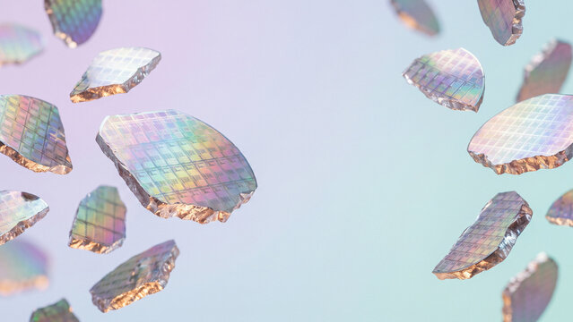 淡い背景に浮かぶ虹色に輝く半導体ウエハーの破片